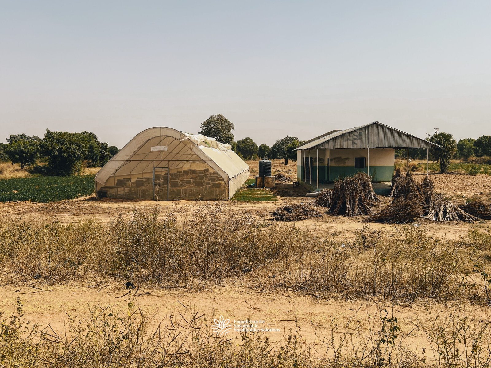 A front-view photograph of Gawon Bature Farmers' Hub, showing the Hub building and greenhouse