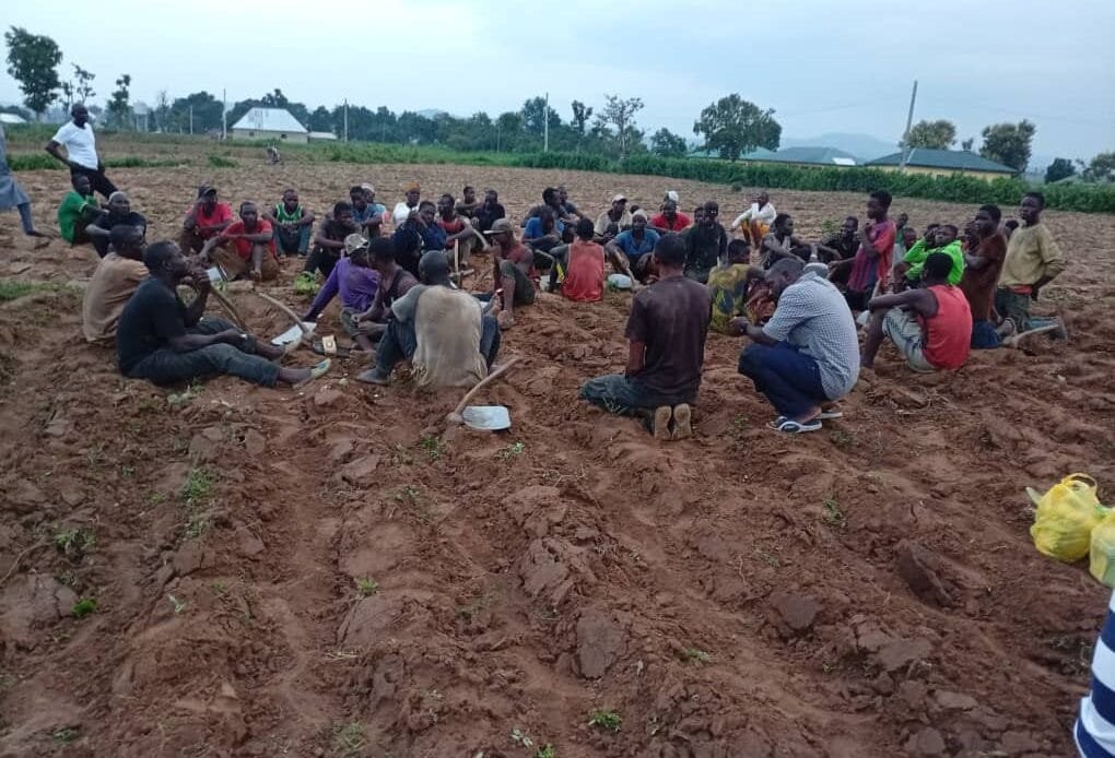 A cross-section of farmers resting on the farm after the training held in Kwali, Abuja.