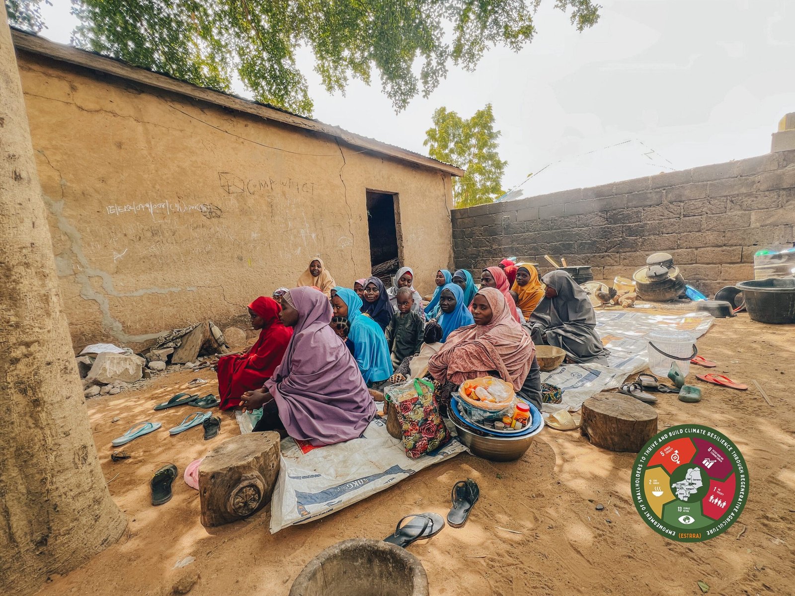 Community women of Faggo with their wards gathered at Altine Lamara's compound