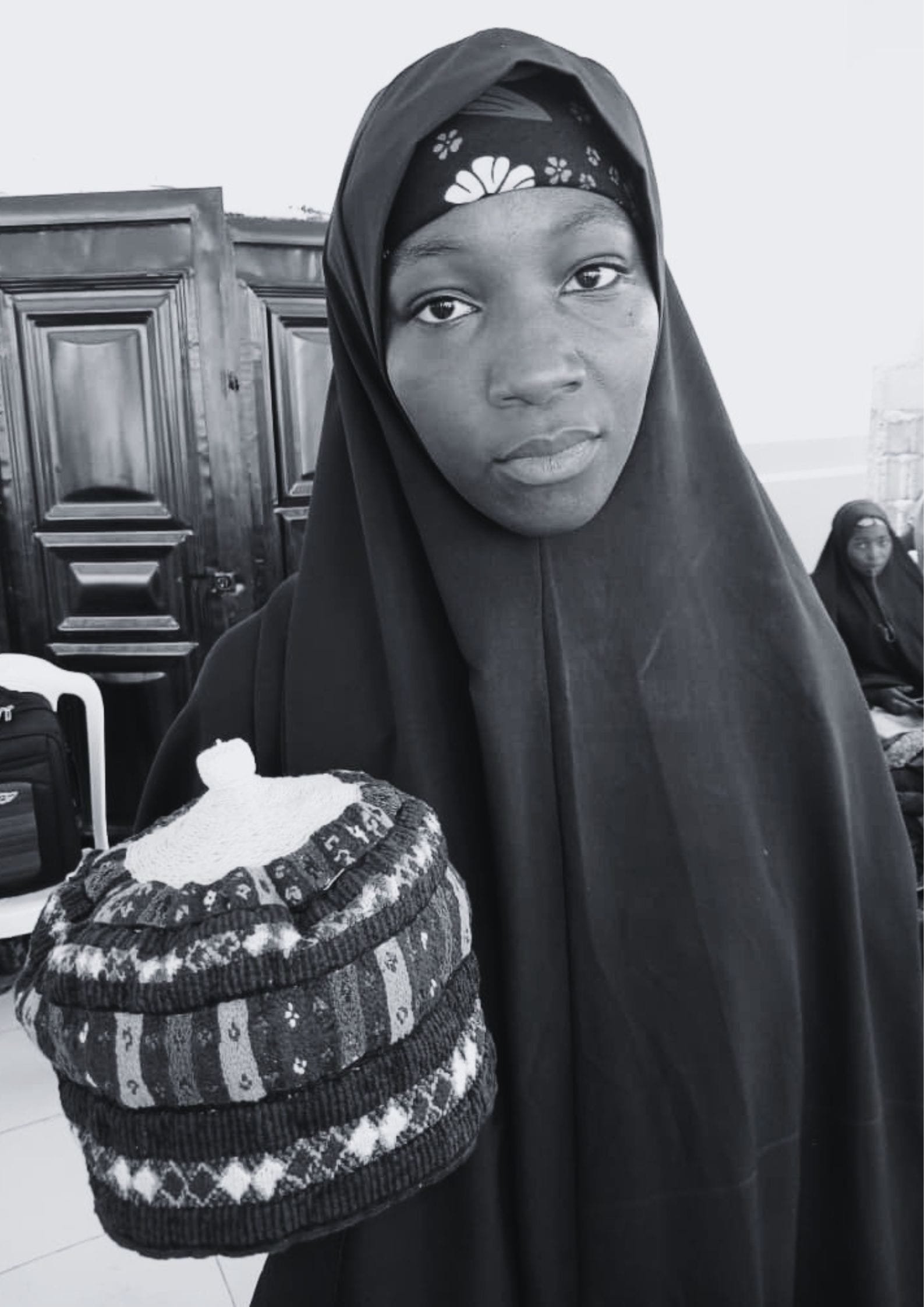 Aisha Auwalu, a tailor from Bulkachuwa posing with a cap she made at the training in Katagum LGA.
